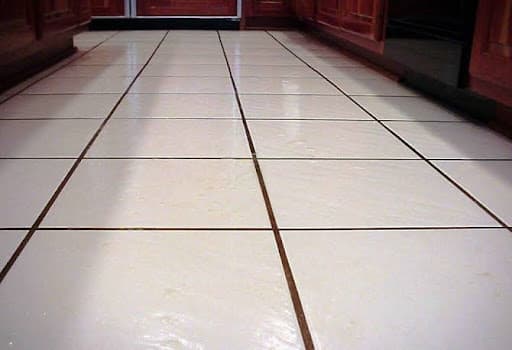 Glossy floor tiles with freshly applied epoxy grout